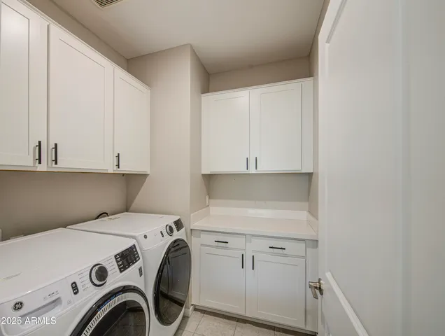 a view of a chairs and table in the garden