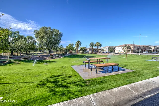a view of a swimming pool with lounge chairs