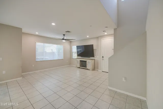 a view of a livingroom with furniture and a flat screen tv