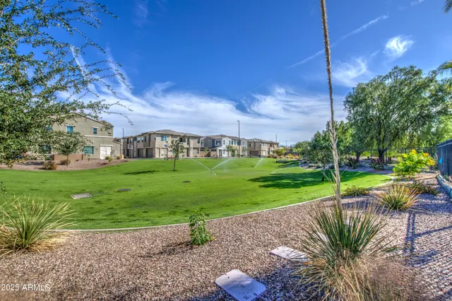 a swimming pool with outdoor seating and yard