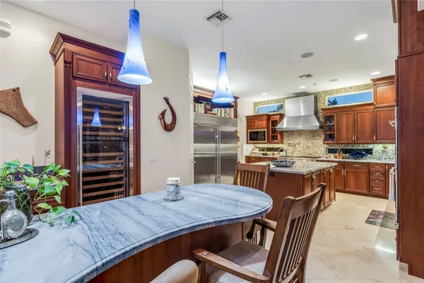 a kitchen with a table and chairs in it