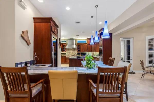 a view of kitchen with furniture and a large window