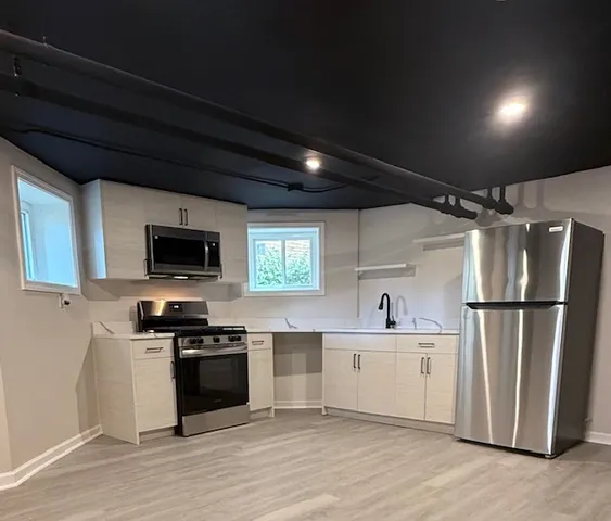 a kitchen with a stove and a microwave
