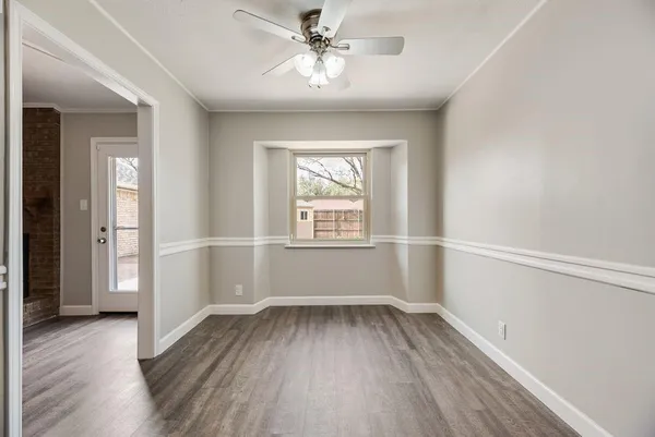 a kitchen with granite countertop white cabinets sink and stainless steel appliances