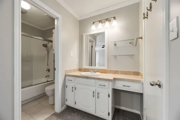 a bathroom with a shower and toilet