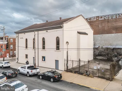 a view of a car park in front of house