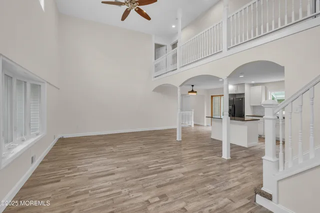 a kitchen with stainless steel appliances granite countertop a sink a refrigerator and a granite counter tops