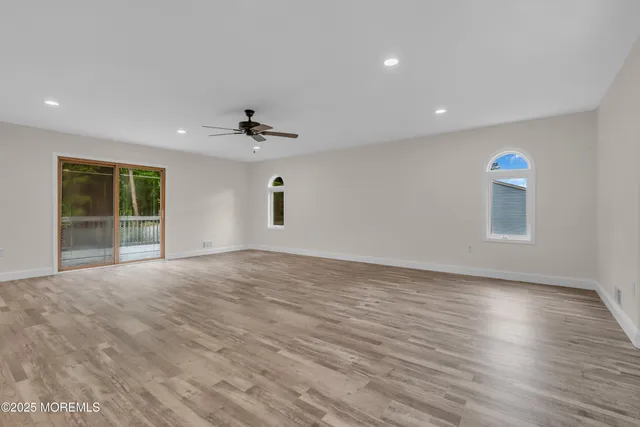 a kitchen with stainless steel appliances granite countertop a sink a stove and a refrigerator