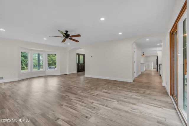 a kitchen with stainless steel appliances granite countertop a sink and a refrigerator