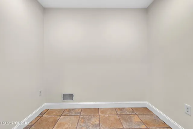 a kitchen with stainless steel appliances granite countertop a sink and a stove top oven