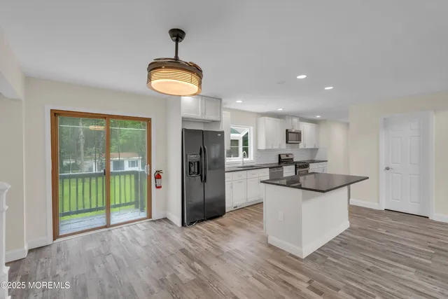 a bathroom with a sink toilet and tub