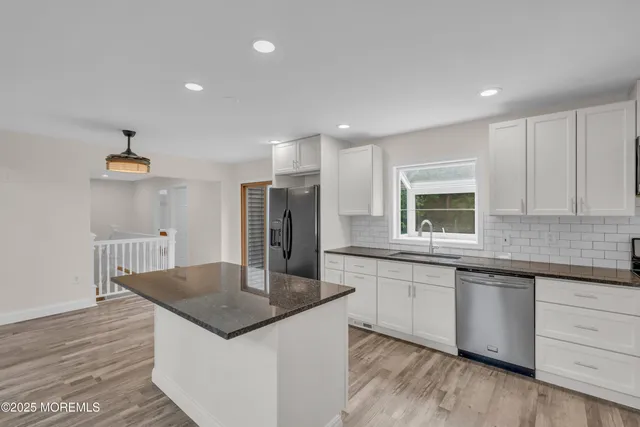 a bathroom with a shower and a mirror