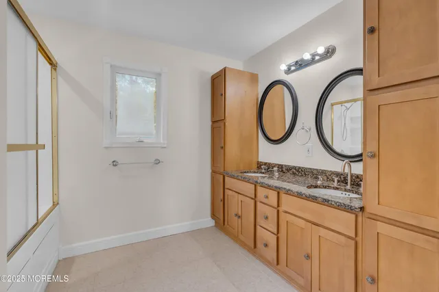 a view of a chair and table in backyard of the house