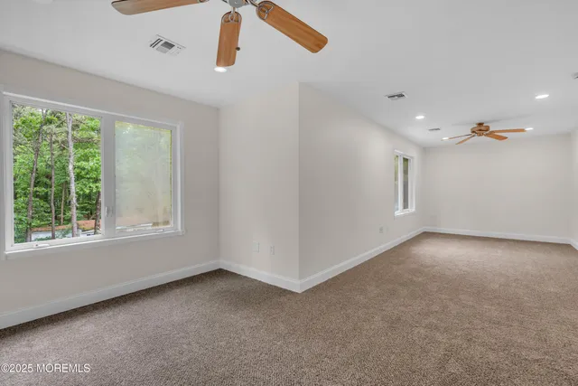 a view of a house with backyard sitting area and garden