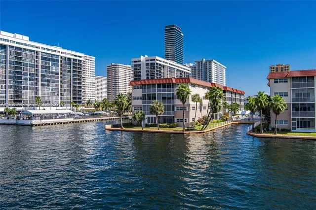 a view of a swimming pool with outdoor seating