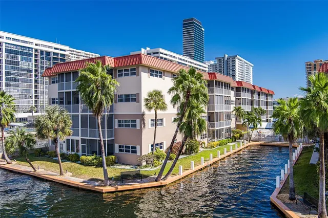 a view of houses with swimming pool