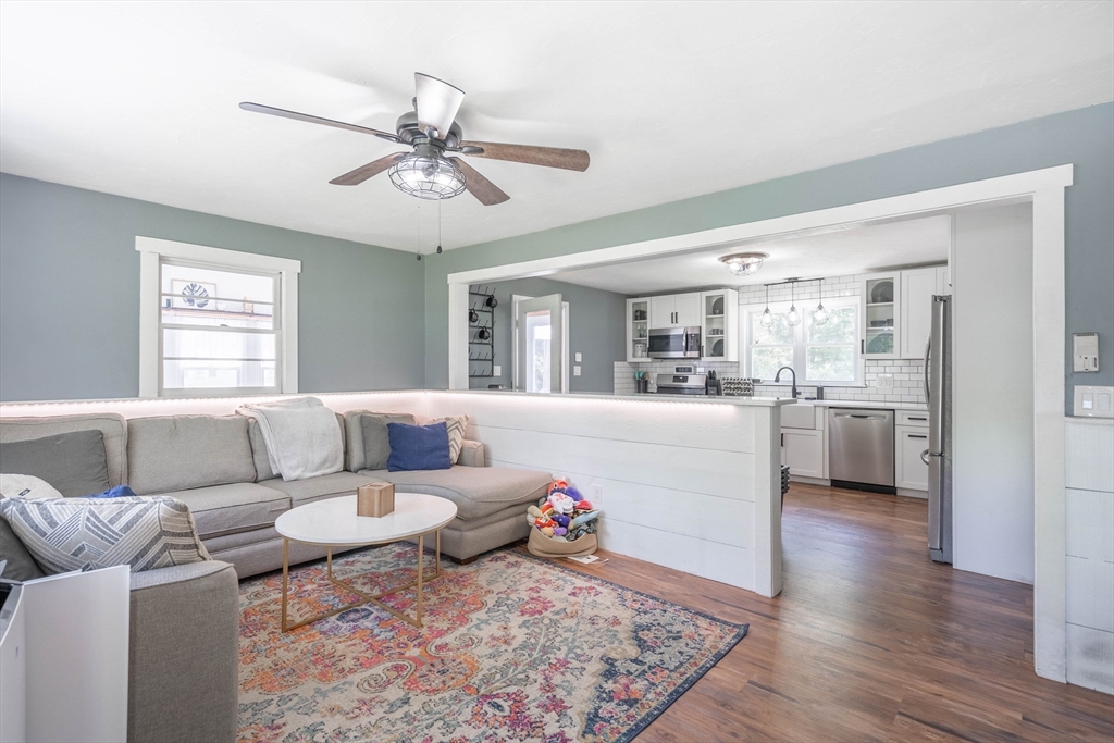 199 New Boston Road Sturbridge, MA 01566 - Photo 5 of 35 a living room with furniture and a view of kitchen