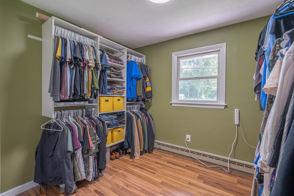 199 New Boston Road Sturbridge, MA 01566 - Photo 10 of 35 a view of walk in closet with clothes and shoes