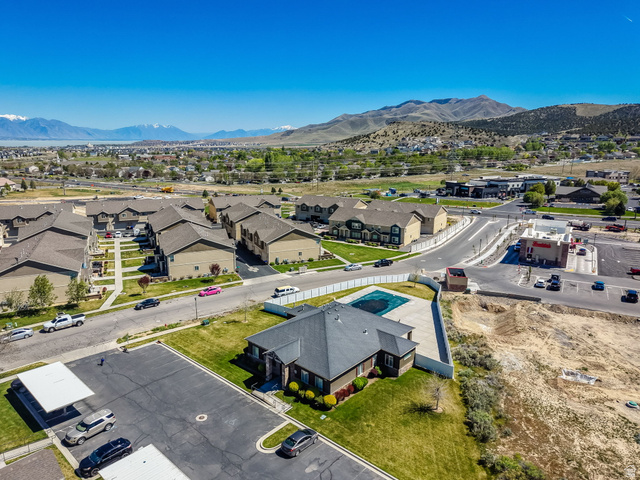 8215 Clear Rock Road, Unit 12 Eagle Mountain, UT 84005 - Photo 28 of 38 Community setting featuring a swimming pool, covered parking, and mountain scenery
