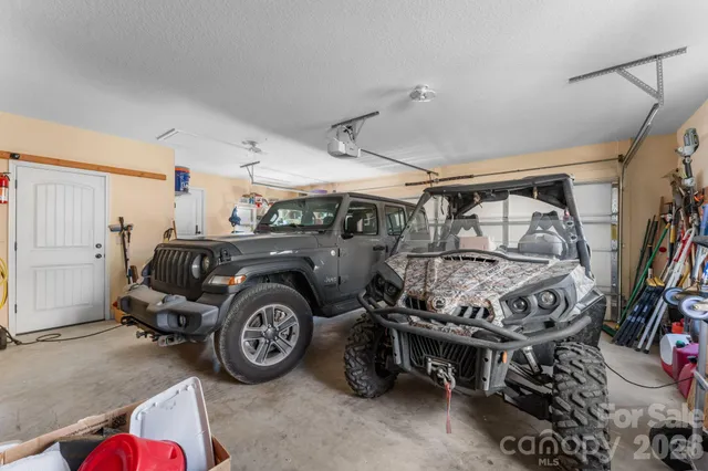 a utility room with furniture and a fan