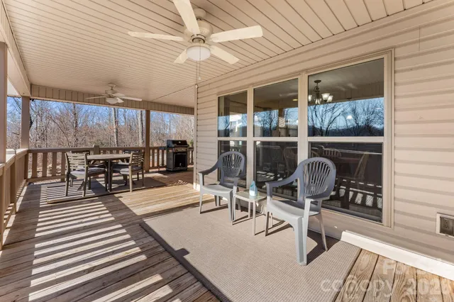 a view of a dining room with furniture wooden floor and chandelier