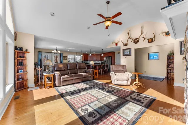 a living room with lots of furniture and painting on the wall