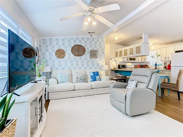 a living room with furniture and a clock