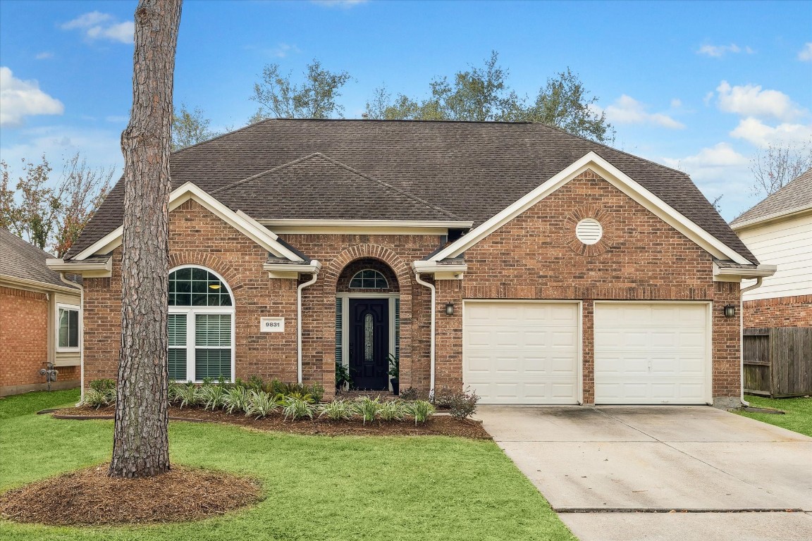 9831 Therrell Drive Houston, TX 77064 - Photo 1 of 44 a front view of a house with a yard and garage