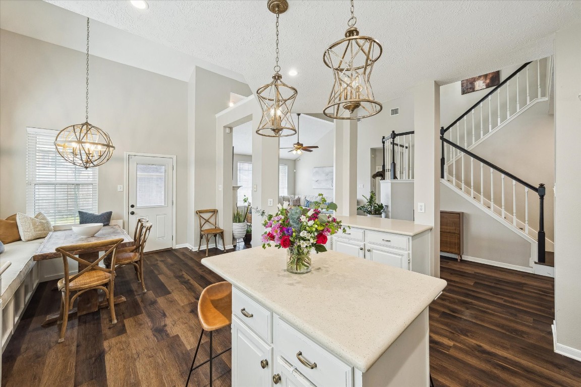 9831 Therrell Drive Houston, TX 77064 - Photo 18 of 44 a view of a dining room with furniture wooden floor and chandelier