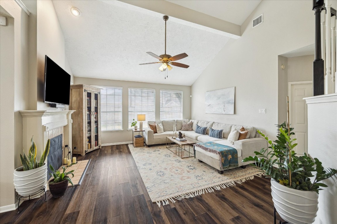 9831 Therrell Drive Houston, TX 77064 - Photo 20 of 44 a living room with furniture a flat screen tv and a fireplace