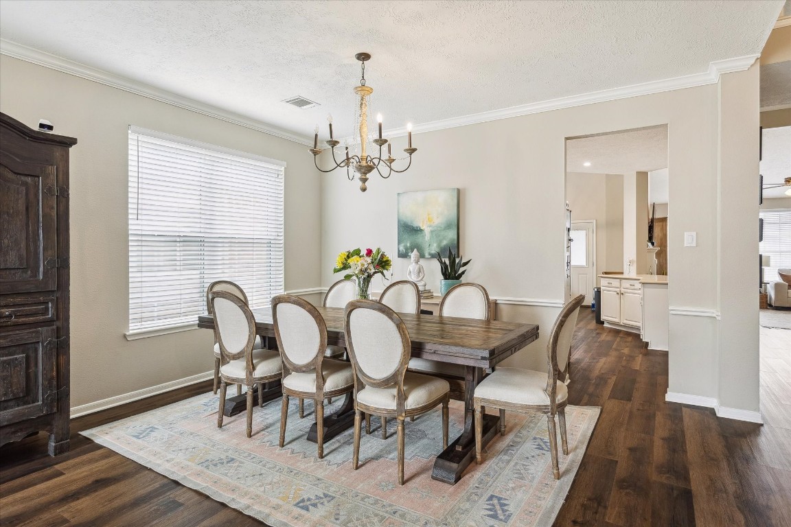 9831 Therrell Drive Houston, TX 77064 - Photo 2 of 44 a view of a dining room with furniture and wooden floor