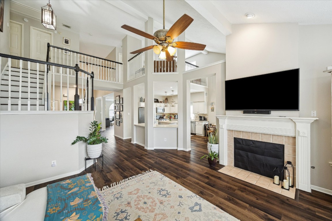 9831 Therrell Drive Houston, TX 77064 - Photo 21 of 44 a living room with furniture a flat screen tv and a fireplace