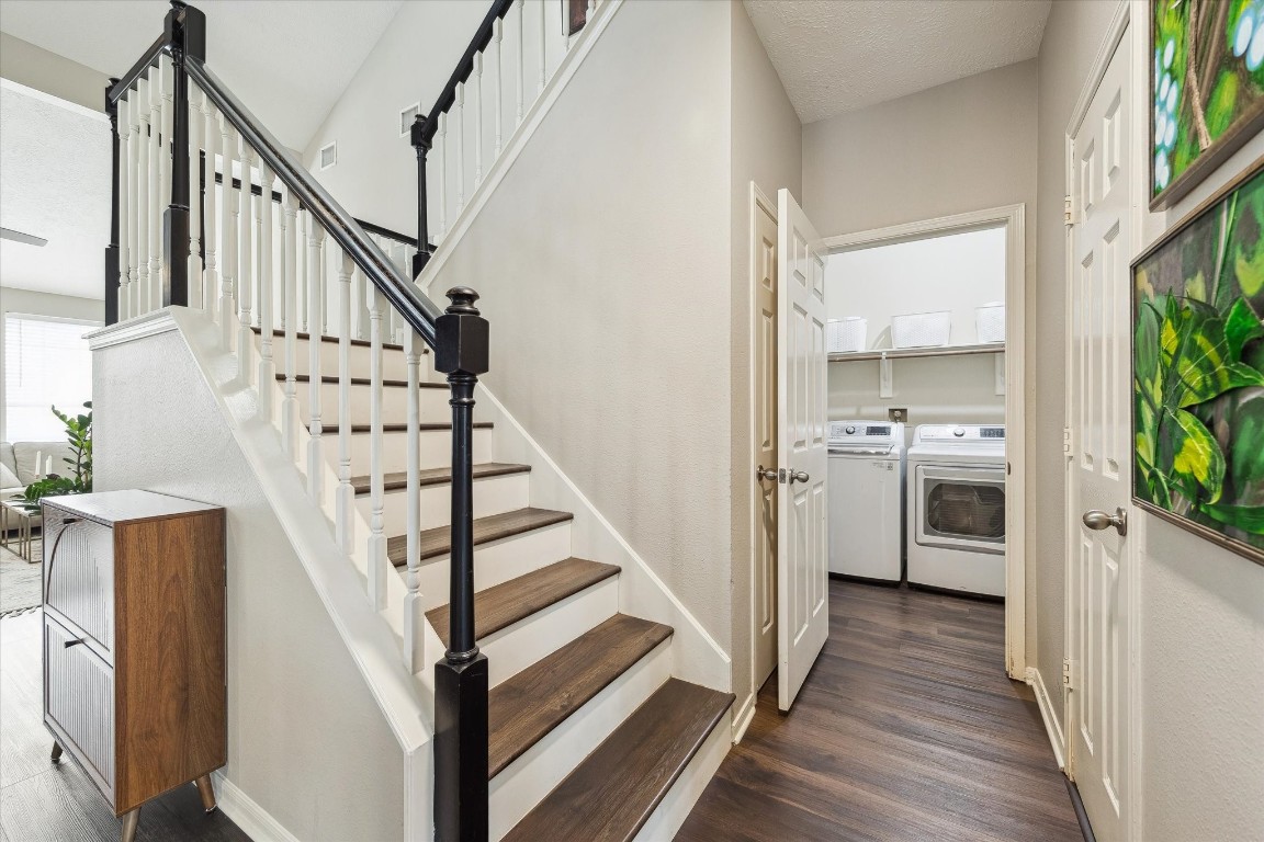 9831 Therrell Drive Houston, TX 77064 - Photo 23 of 44 a view of entryway and kitchen with wooden floor