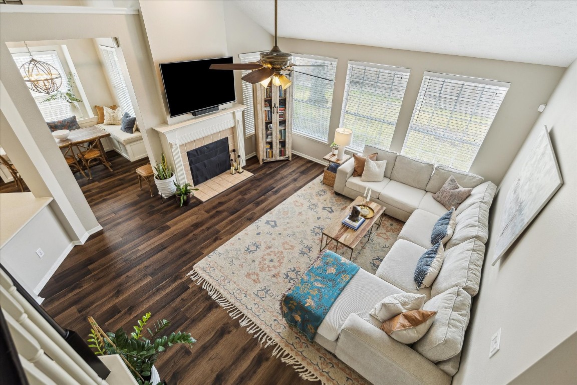 9831 Therrell Drive Houston, TX 77064 - Photo 25 of 44 a living room with furniture a flat screen tv and a fireplace