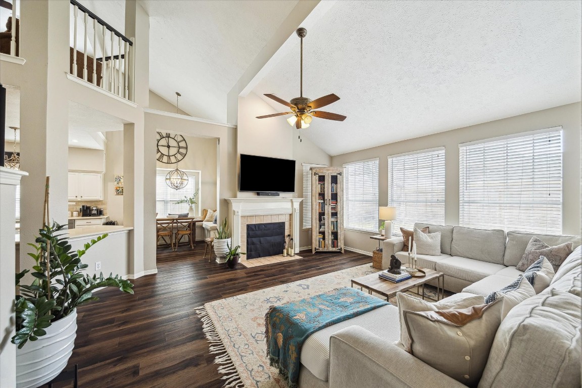 9831 Therrell Drive Houston, TX 77064 - Photo 3 of 44 a living room with furniture a fireplace and a flat screen tv