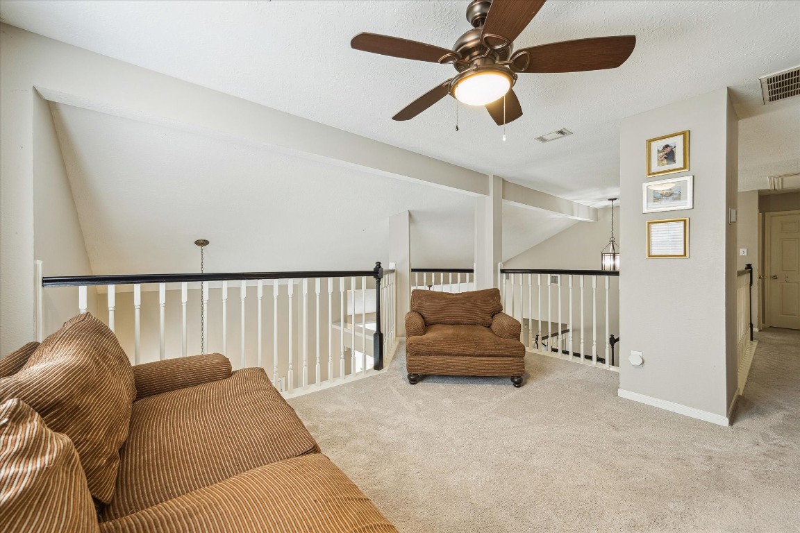 9831 Therrell Drive Houston, TX 77064 - Photo 32 of 44 a living room with furniture and a ceiling fan