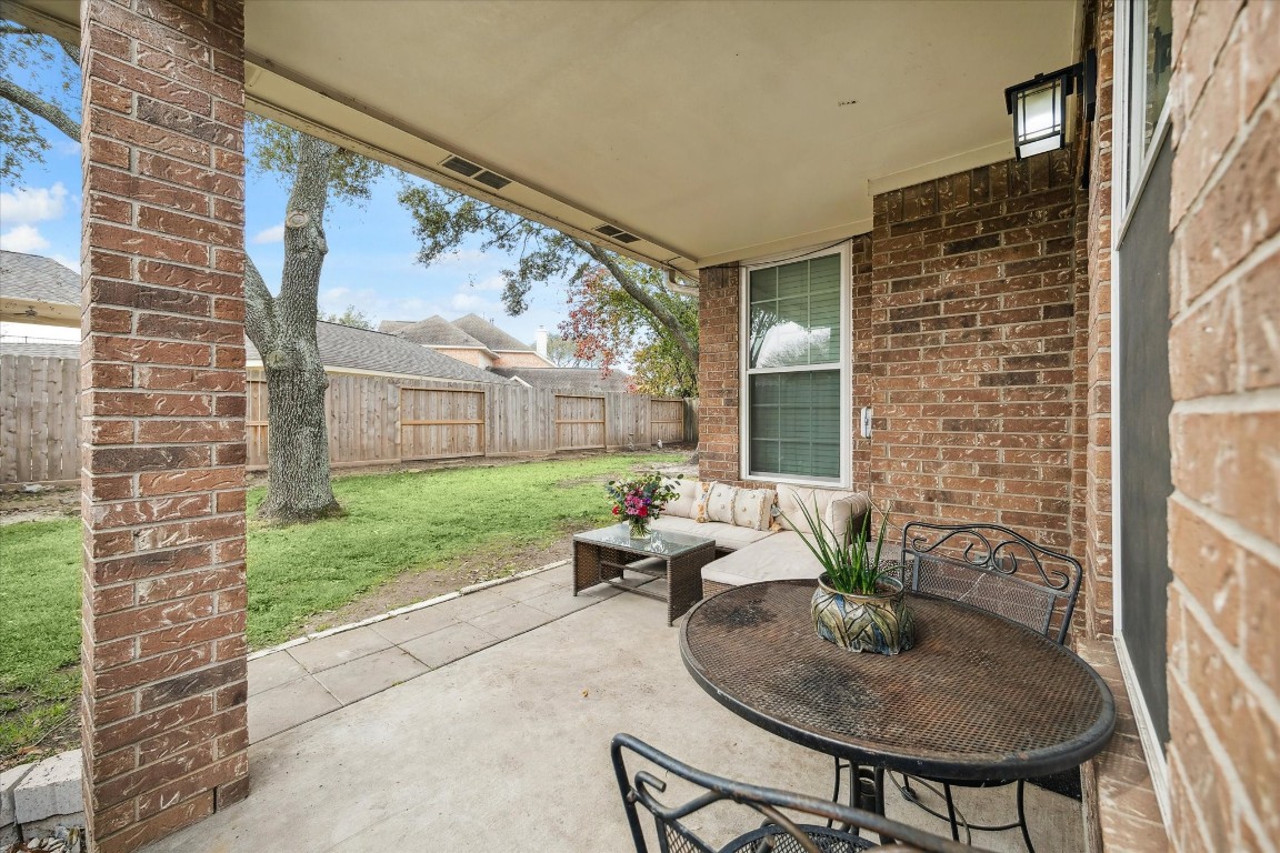 9831 Therrell Drive Houston, TX 77064 - Photo 40 of 44 a house view with a seating space and garden