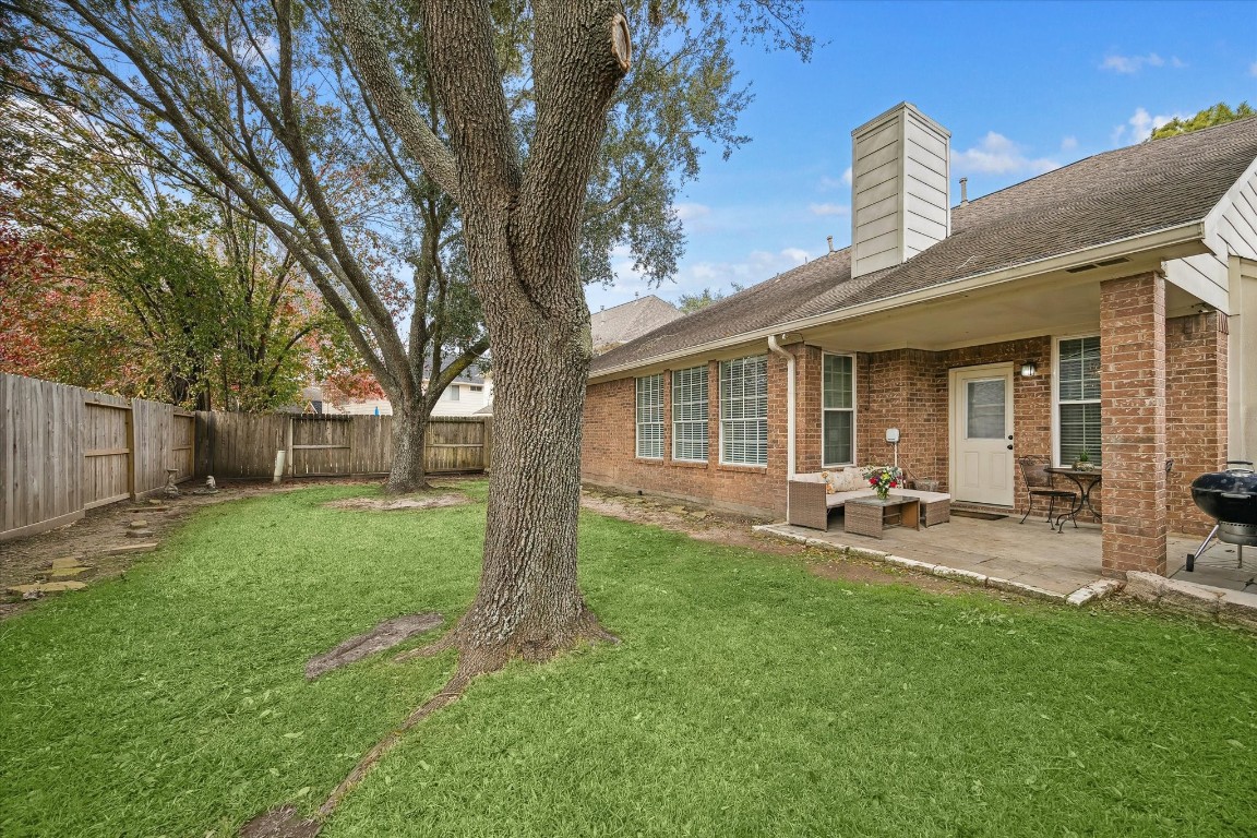 9831 Therrell Drive Houston, TX 77064 - Photo 5 of 44 a view of a house with backyard and sitting area