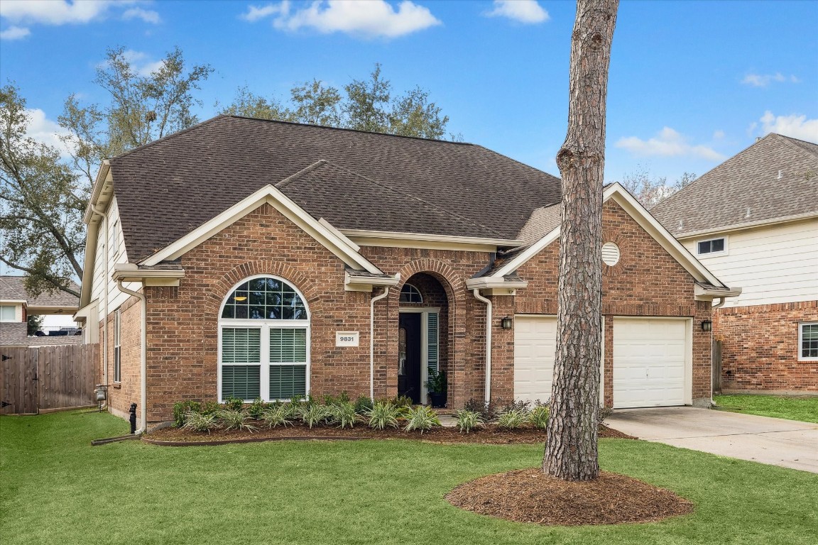 9831 Therrell Drive Houston, TX 77064 - Photo 6 of 44 a front view of a house with a yard
