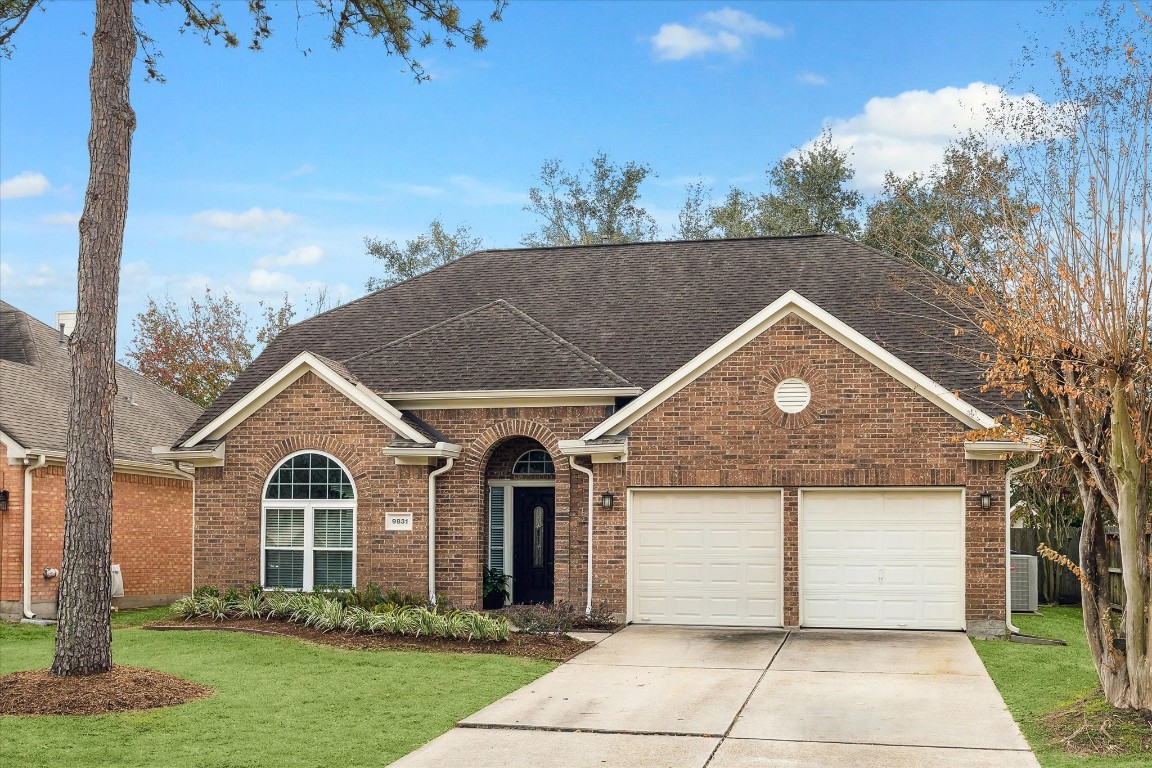 9831 Therrell Drive Houston, TX 77064 - Photo 7 of 44 a front view of a house with a yard