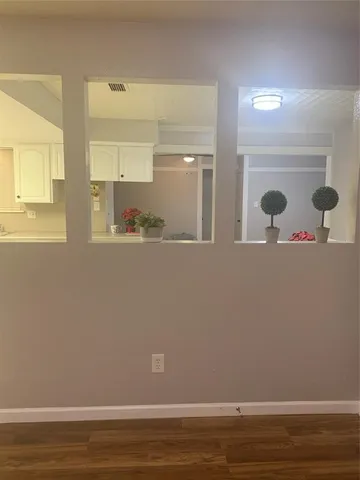 a view of a small space with wooden floor