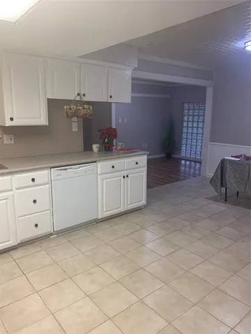 a kitchen with white cabinets
