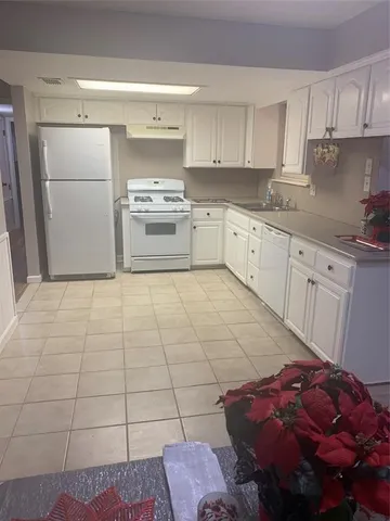 a kitchen with a cabinets and appliances