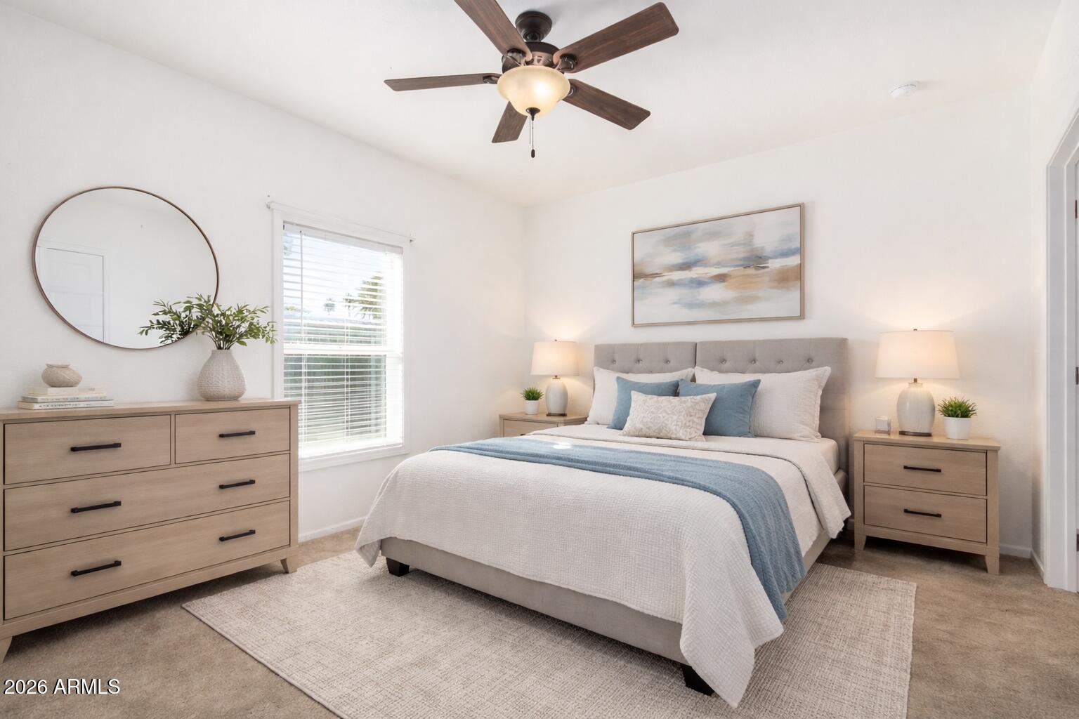 10540 East Apache Trail, Unit 93 Apache Junction, AZ 85120 - Photo 15 of 27 a bedroom with a bed and a chandelier