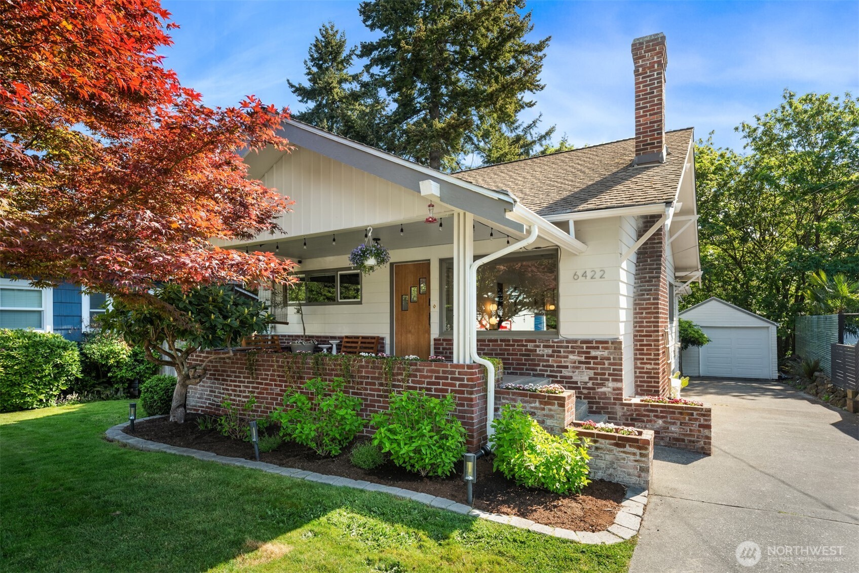 6422 49th Avenue Southwest Seattle, WA 98136 - Photo 1 of 20 a front view of a house with garden