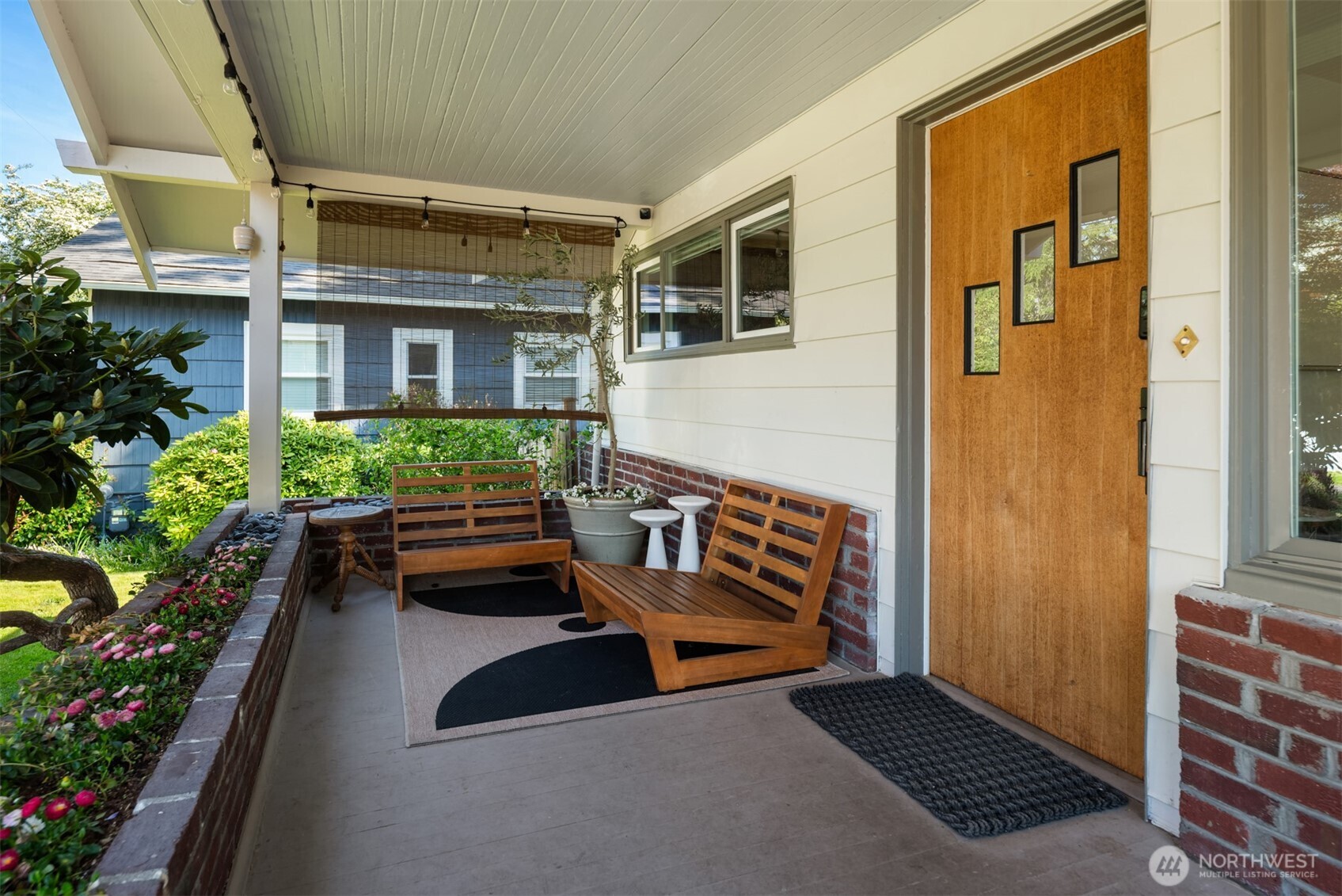 6422 49th Avenue Southwest Seattle, WA 98136 - Photo 4 of 20 a backyard of a house with outdoor seating