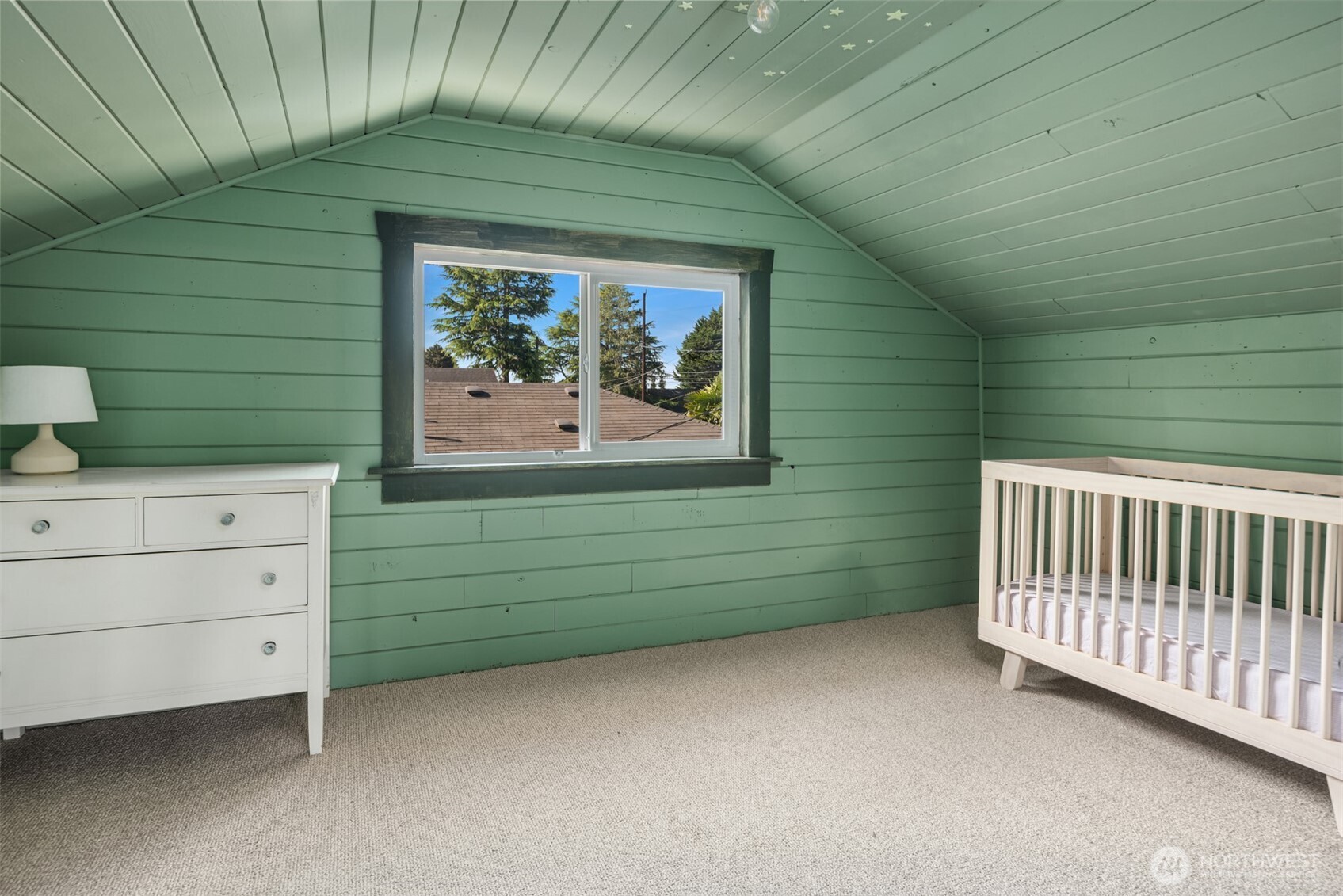 6422 49th Avenue Southwest Seattle, WA 98136 - Photo 10 of 20 a room with a baby crib and a dresser