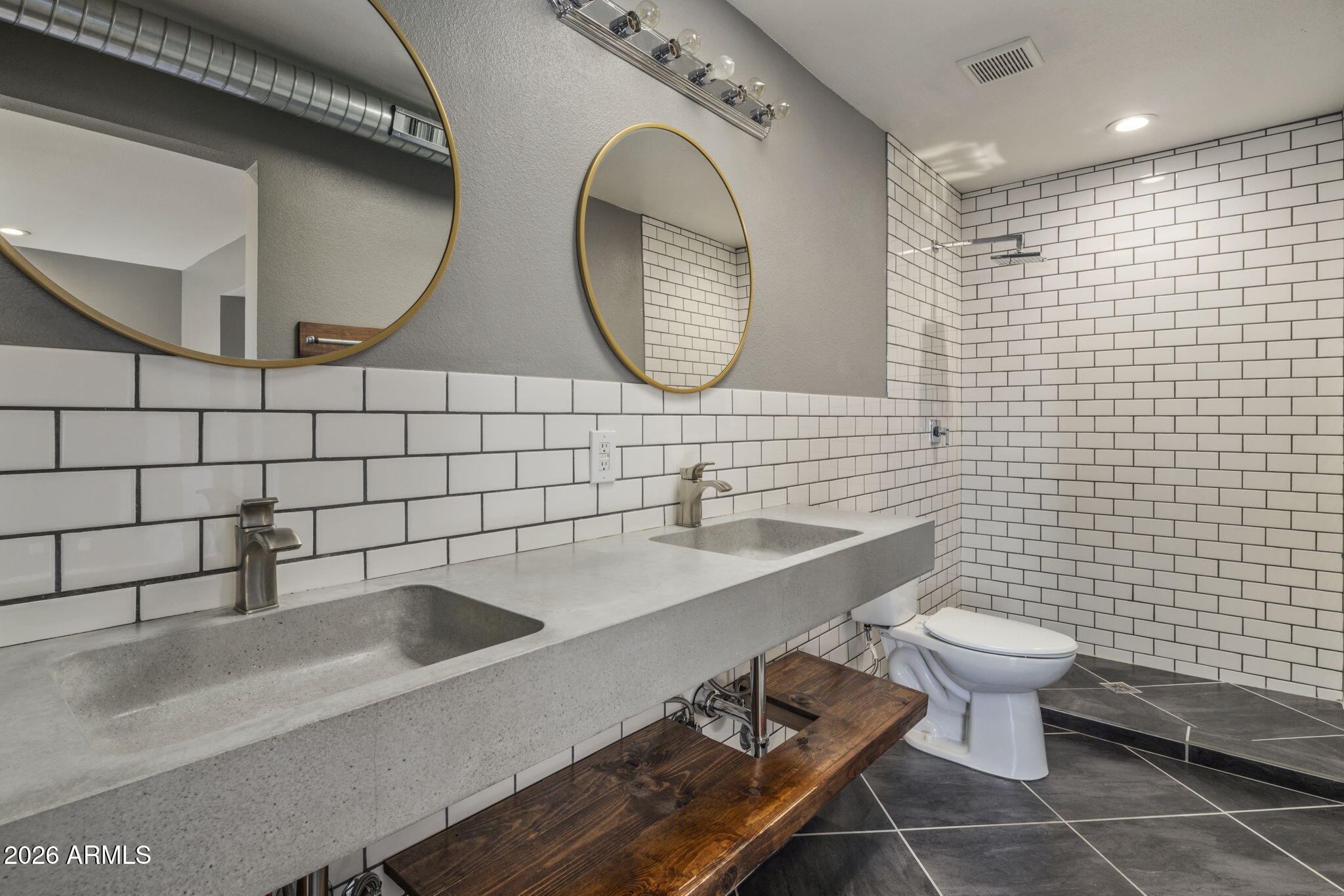 1842 West Marlette Avenue Phoenix, AZ 85015 - Photo 14 of 30 a bathroom with a toilet a sink and mirror