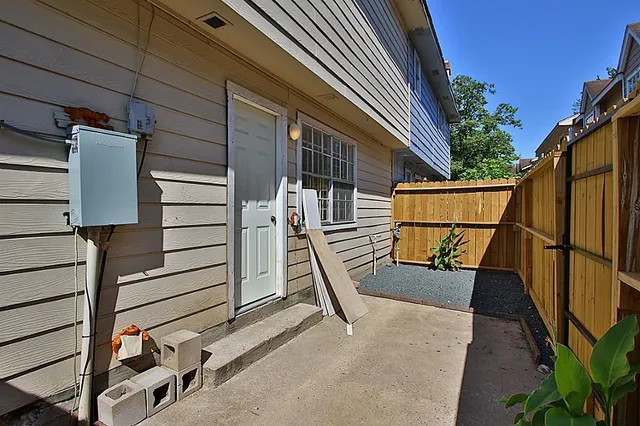 a view of backyard with a deck
