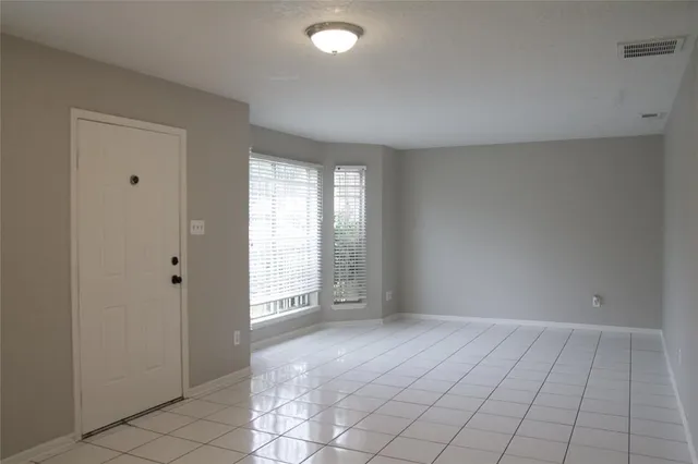 a view of an empty room and window